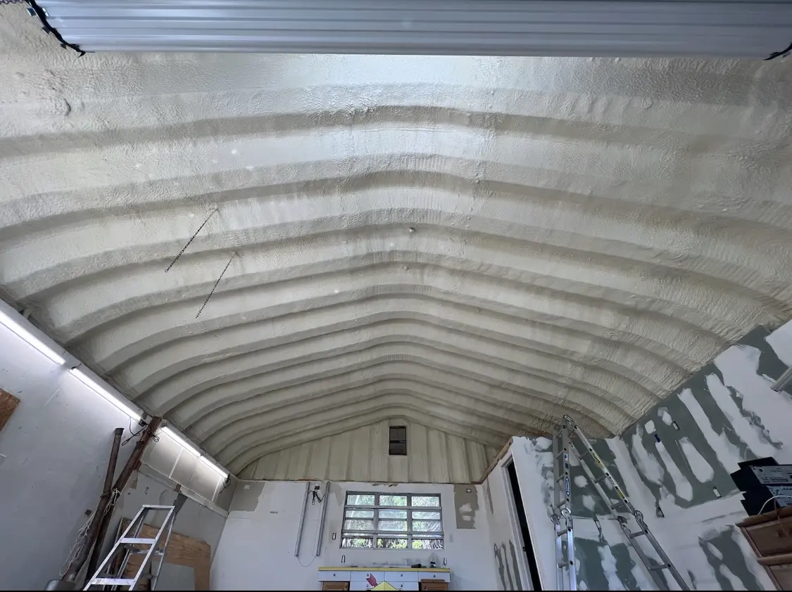 Spray polyurethane foam applied to the underside of a metal roof deck in Buckhead